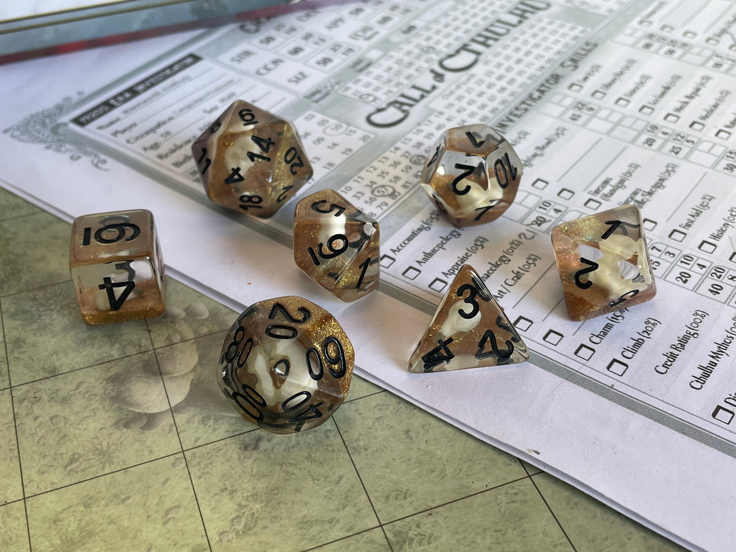 Entombed Poly Dice Set- Bird skull White in Gold